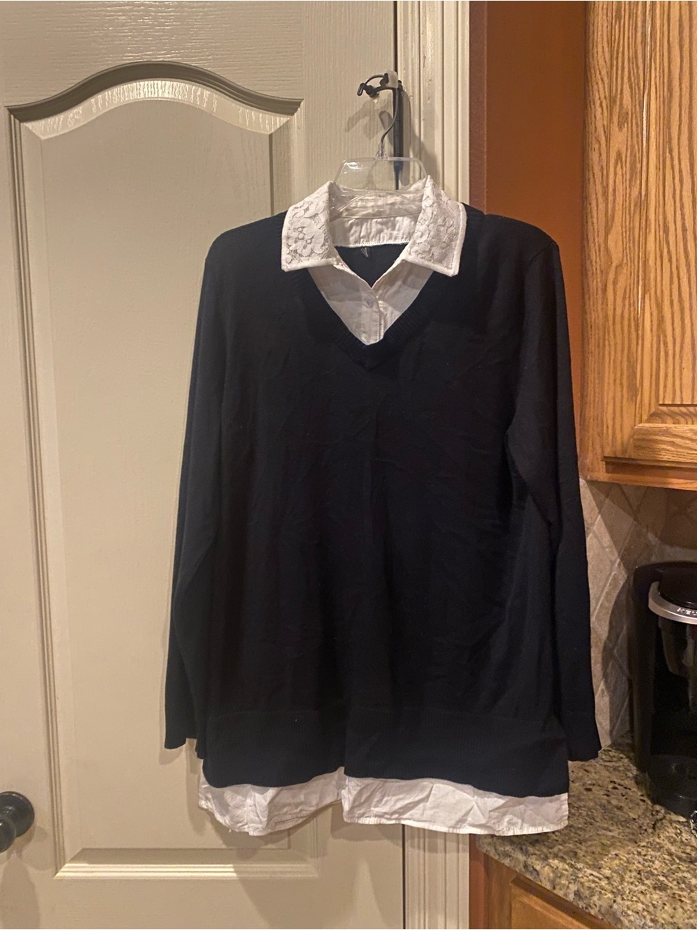 Black V-Neck Sweater with White Shirt Layered Look